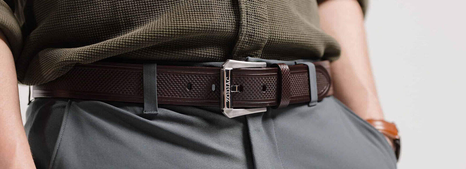 Man wearing brown Zodiac belt